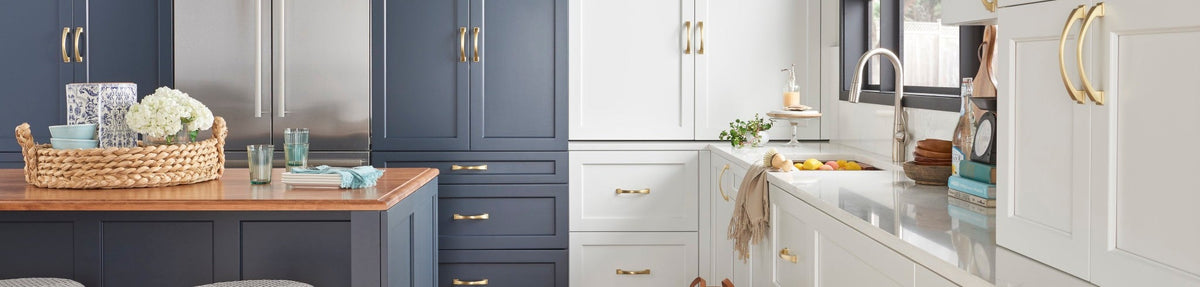 Cabinet pulls on navy and white kitchen cabinetry